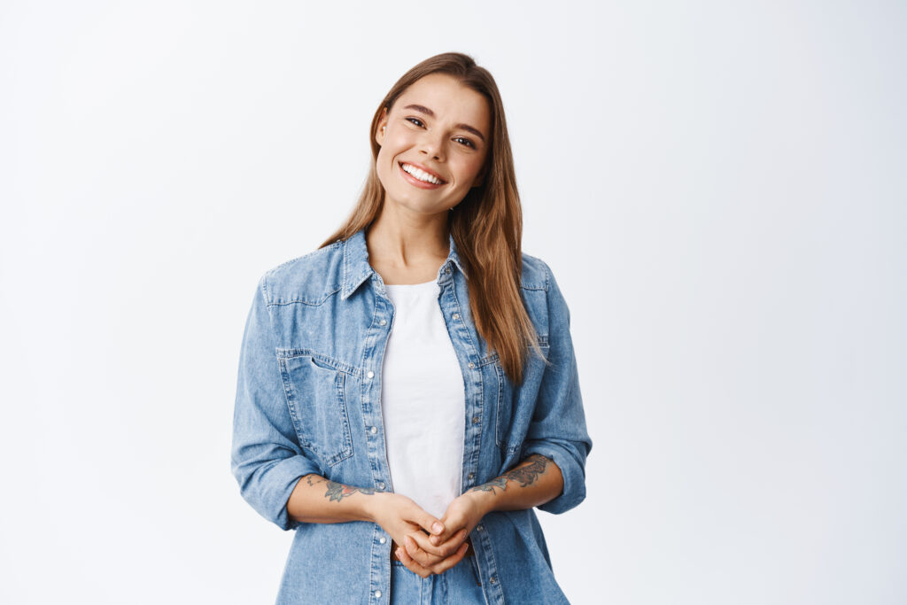 woman with healthy smile illustrates the importance of understanding how sugar affects your teeth and protects her smile with dentist-recommended tips