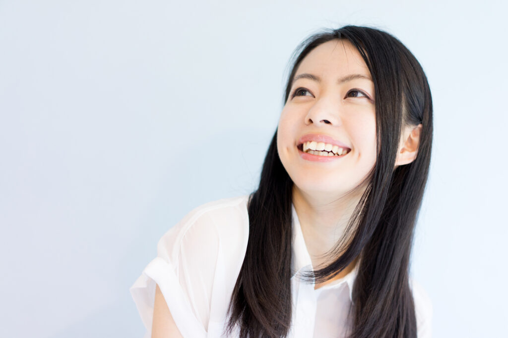 smiling young woman has healthy teeth and confidence
